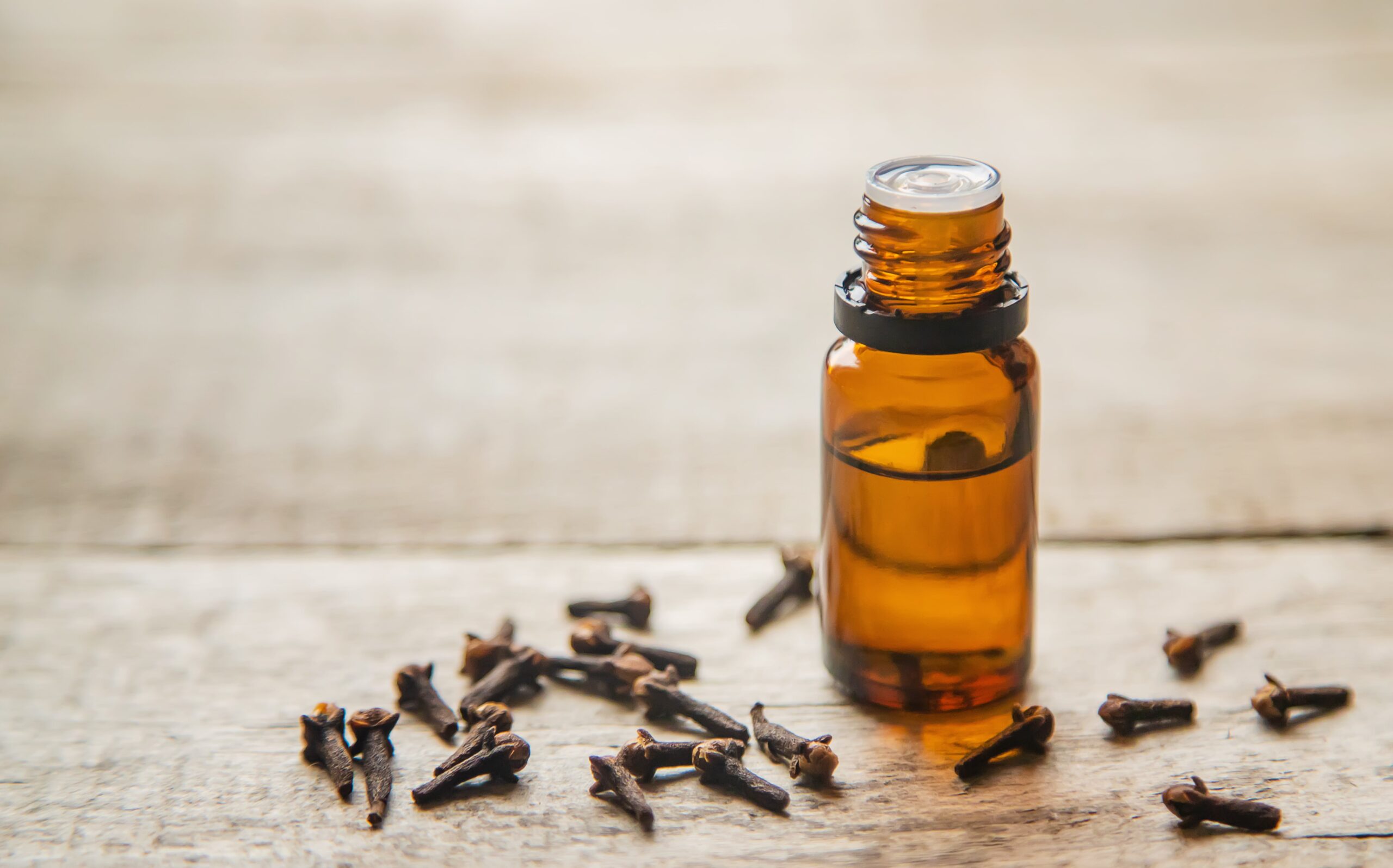 Clove essential oil in brown bottle