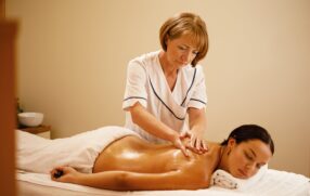lady having lymphatic drainage massage with natural oils