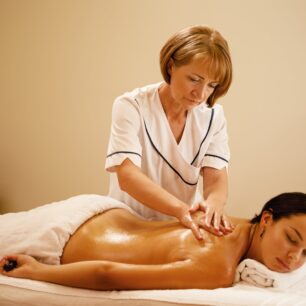 lady having lymphatic drainage massage with natural oils