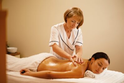 lady having lymphatic drainage massage with natural oils