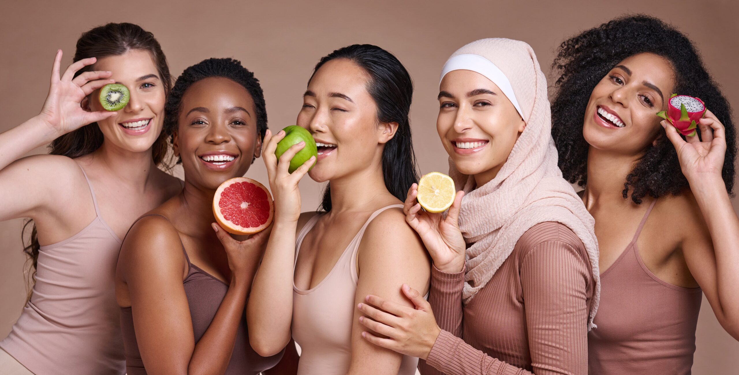 diverse group of women with different fruits