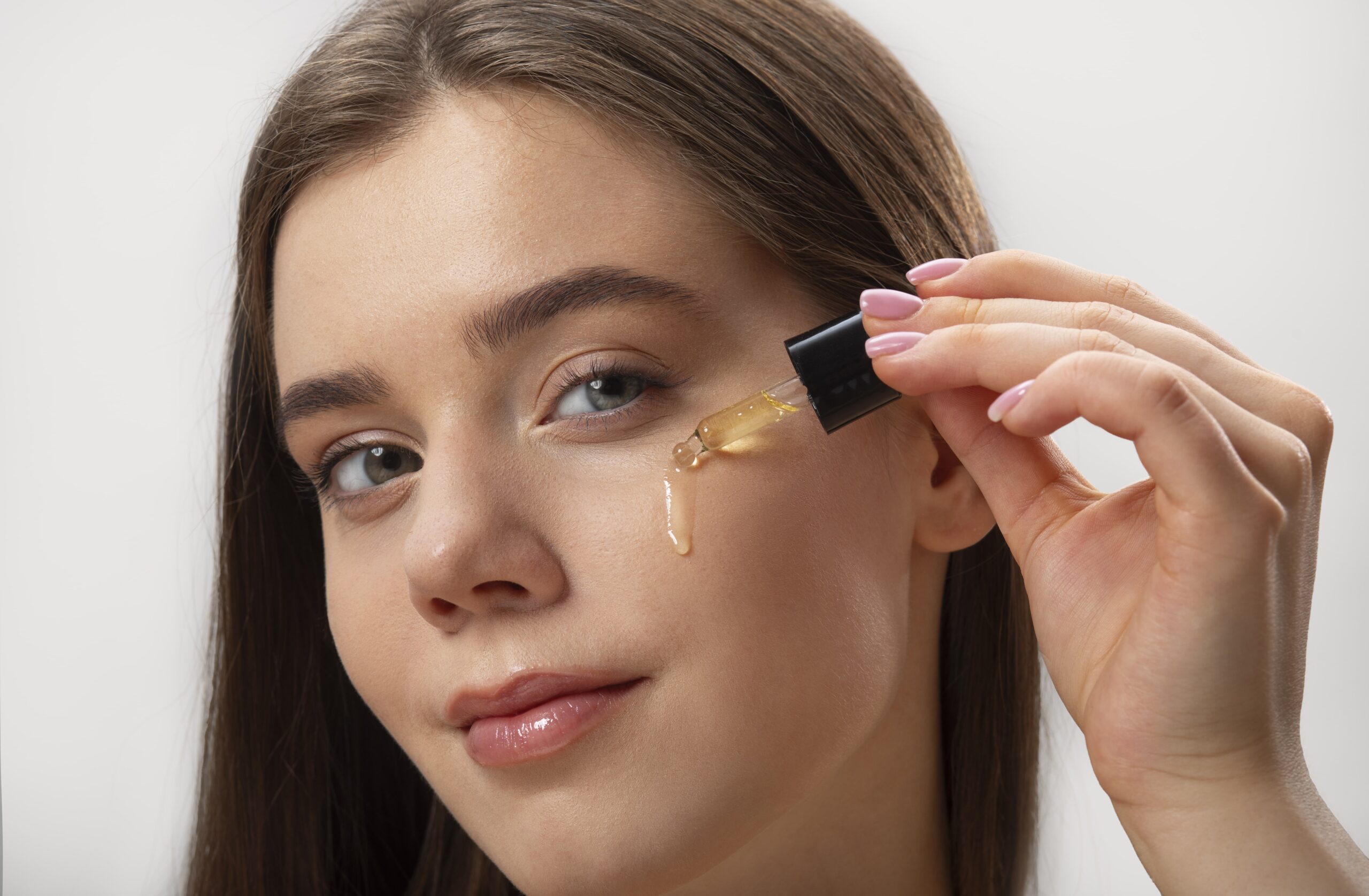 young woman using natural oil