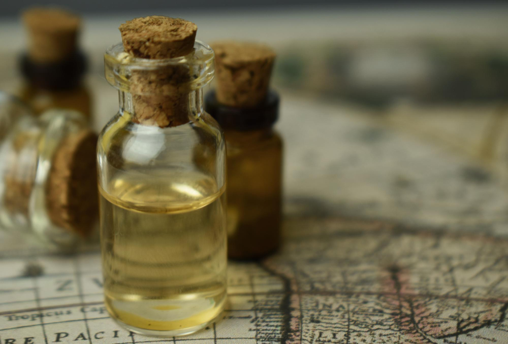 ancient bottle of oil on map